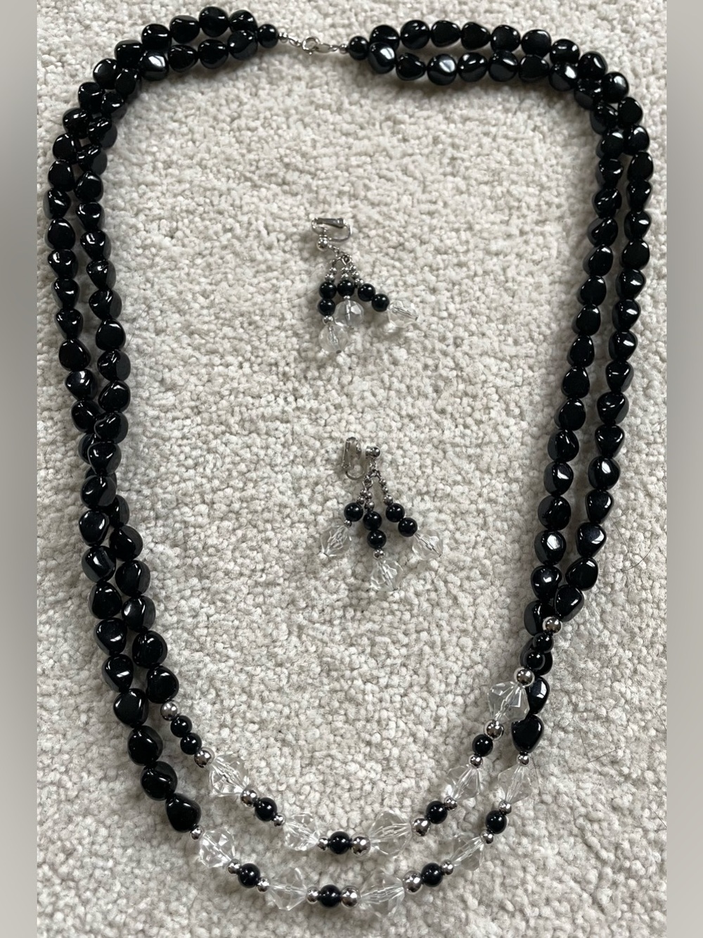 Vintage Trifari two-strand black & clear faceted bead necklace with earrings.
